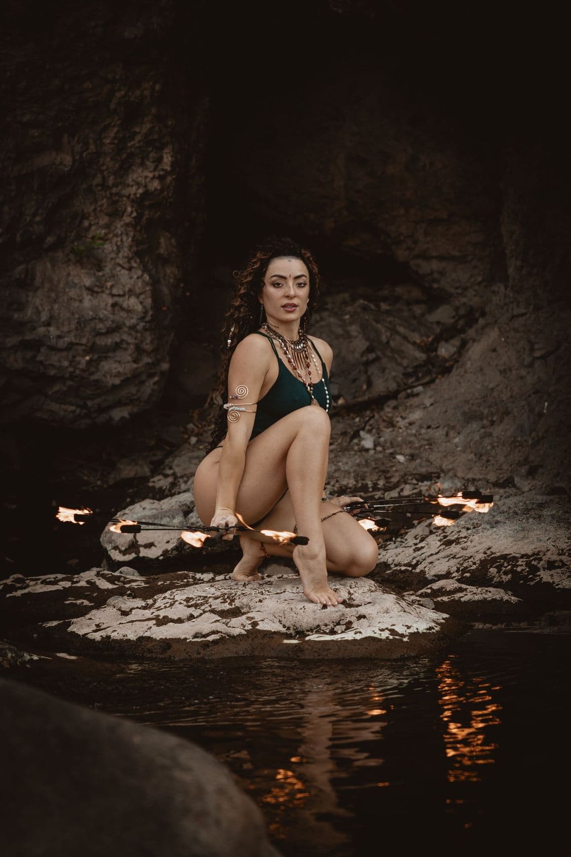 Rose Wild seated with fire tools